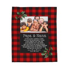 a red and black plaid christmas photo frame with holly on the side, featuring an image of