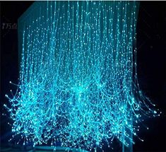 blue lights hanging from the ceiling in a dark room