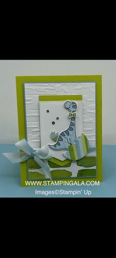 a card with a giraffe on it, and ribbon around the edge that says stampin'up