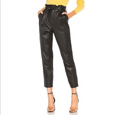 Lost The Belt Nail Laid-Back Elegance With The Lovers + Friends Zeal Pant. Genuine Leather Sculpts This Paperbag Style, While A Belted Waist Strongly Accentuating The Waistline Creates Bountiful Darts Through The Legs Which Taper Neatly To A Crop Just Shy Of The Ankles. Self: 100% Leather Lining: 96% Poly 4% Elastic Professional Leather Clean Only Zip Fly With Hook And Bar Closure Pleated And Belted Waist With D-Ring Closure Side Slant Pockets 16" At The Knee Narrows To 13" At The Leg Opening Imported Fitted Leather Pants With Belt Loops For Party, High-waisted Leather Pants With Belt Loops, Chic Fitted Leather Pants With Belt Loops, Chic Leather Pants With Belt Loops For Going Out, Party Leather Pants With Belt Loops And Straight Leg, Party High-waisted Leather Pants With Belt Loops, Chic Leather Pants With Belt Loops For Night Out, Chic Tapered Leg Leather Pants, High-waisted Leather Pants With Belt Loops For Night Out