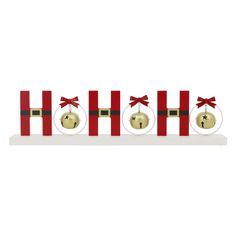 three red and white christmas bells with bows on them