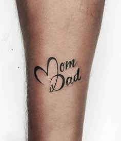 a man with a tattoo on his leg that says, om dad in black ink