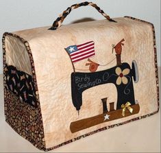 a quilted sewing case with an american flag on the front and a sewing machine on the back