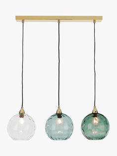 three glass pendant lights hanging from a wooden beam