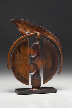 a sculpture made out of metal and wood