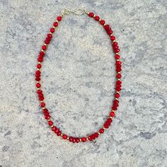 A timeless accessory, this red coral necklace features faceted and round coral beads contrasted by gold plated accent beads, connected with a hook closure. An elegant and sophisticated piece that will luxuriously adorn any look. Red Coral gold plated brass length: 20" Handmade in Lincoln, Nebraska Luxury Red Coral Necklace With Large Beads, Elegant Red Beaded Necklace With Lobster Clasp, Red Rondelle Beads Jewelry With Faceted Detail, Red Rondelle Jewelry With Faceted Beads, Red Coral Necklaces With Round Faceted Beads, Red Coral Necklace With Faceted Beads, Faceted Red Coral Necklace, Red Rondelle Beaded Necklace, Single Strand, Gold Beaded Necklaces With Red Coral Round Beads