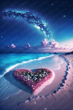 a heart - shaped object on the beach with stars in the sky and water behind it