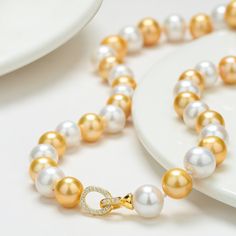 10-11mm Dyed Golden and White Freshwater Pearl Necklace
 #pearls #TimelessPearls #pearlset #pearlscollection #pearlearrings #SouthSeaPearls #PearlJewellery #PearlBling #PearlPerfection #realpearls Mabe Pearl, White Pearl Necklace, Pearl Jewelry Necklace, Freshwater Pearl Necklace, White Necklace, Pearl Set