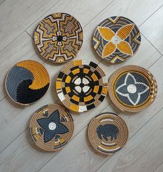 woven baskets are arranged on the floor in different patterns