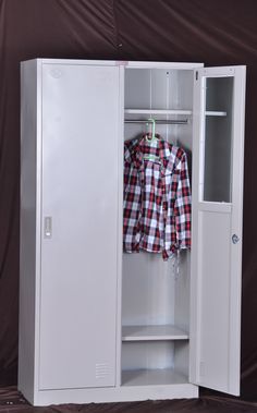 a white locker with a red and black checkered shirt hanging on it