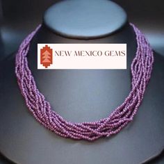 This is a southwest glass seed bead multi-strand necklace. These beads are dark plum purple.  Dress up your outfit with a minimalist traditional mixed hand- beaded necklace.  * 10 strands of plum colored glass seed beads * adjustable from 18" - 21"long * hand beaded in New Mexico * hook and eye clasp with extender * Gift boxes available for purchase shown in photos. * Also comes in a nice presentation box. Check out the rest of our collection: https://www.etsy.com/shop/NewMexicoGems Bohemian Purple Polished Beads, Traditional Purple Beaded Necklace With Round Beads, Purple Multi-strand Bohemian Beads, Purple Multi-strand Beaded Necklace, Bohemian Purple Beaded Necklaces With Polished Beads, Bohemian Multi-strand Purple Beads, Purple Bohemian Multi-strand Beads, Bohemian Purple Multi-strand Beads, Purple Multi-strand Beads For Jewelry Making