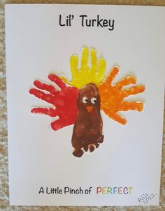 a handprinted turkey is displayed on a piece of paper