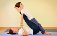 a man and woman are doing yoga together