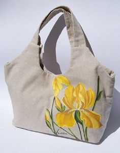 a bag with yellow flowers painted on it