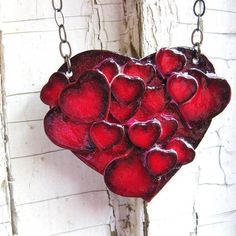 "---This large red hearts necklace is covered with 18 small hearts that are raised off the 2 1/2\" x 2\" base. The whole thing is made with a vintage image on a durable plastic then covered in a candy apple coating of sealer.  A 16\" oval chain with lobster clasp was used but I can alter the length of the chain if you convo me with your request.   This is a perfectly unique gift for the one you love ...or to treat yourself to something special.   **For more fun items check out my shop here **  http://www.etsy.com/shop/whatanovelidea?ref=si_shop" Handmade Heart Necklace For Valentine's Day, Handmade Red Heart Necklace For Jewelry Making, Handmade Red Heart Necklace For Valentine's Day, Unique Red Necklaces For Valentine's Day, Hallmarked Heart-shaped Necklace For Valentine's Day, Heart-shaped Valentine's Day Costume Jewelry Necklace, Unique Red Heart-shaped Necklace, Vintage Red Heart-shaped Necklace, Red Heart-shaped Necklace For Valentine's Day