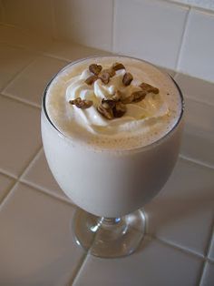 there is a drink with whipped cream and nuts in it