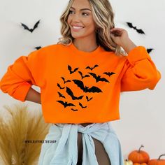 "Halloween Bats Sweatshirt, Bat Sweater, Glitter Black Bats Shirt, Bat Shirt, Spooky Sweatshirt, Halloween Sweatshirt, Vampire Bat, Bat Gifts Our spooky Halloween bats sweatshirt makes the perfect addition to your wardrobe this Halloween. The bats are made of a high quality black or silver glitter that won't fall off or leave glitter anywhere, not even after washing. If you have any questions feel free to reach out and I am happy to help. PLEASE NOTE: THIS SWEATSHIRT IS A UNISEX FIT SO IT DOES R Bat Sweater, Spooky Sweatshirt, Bat Shirt, Vampire Bat, Sweatshirt Halloween, Black Bat, Halloween Bats, Halloween Sweatshirt, Spooky Halloween