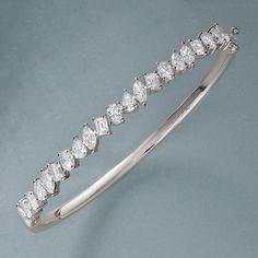 Indulge in luxury with this breathtaking 4 1/2 carat multi-shape diamond bangle bracelet. Crafted in 14K solid gold, this elegant piece features a stunning array of diamonds in various shapes, expertly set to reflect maximum brilliance. Perfect for special occasions or adding a touch of sophistication to your everyday look, this bracelet is a statement of timeless elegance and refined beauty.Designed for women who appreciate luxury, this diamond bangle combines classic craftsmanship and modern s Luxury Wedding Diamond Bracelet With Marquise Cut, Luxury Marquise Cut Diamond Bracelet For Anniversary, Elegant Diamond Bangle With Baguette Diamonds, Fine Jewelry Diamond Cut Bangle Bracelet, Wedding Bangle In White Gold With Baguette Diamonds, Wedding Diamond Bracelet With Marquise Cut, Diamond Accents Baguette Cut Bangle, Elegant Cubic Zirconia Bangle With Baguette Diamonds, Modern Diamond Bangle With Baguette Cut