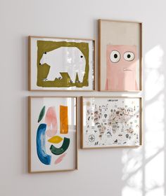 three framed art pieces hang on the wall next to each other, including one with an animal