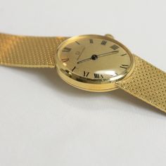 "Ladies 18K Yellow Gold Universial Geneve Bracelet Watch, Model \" Classic\", with 17 Jewel Manual Wind movement, runs well, Cal 42, Serial # 32618, 7 inch long Total Weight: 41.1 grams Vintage Estate Gold, all items have been tested and examined. These are all one of a kind items. Shipping: All items are hand-picked and packed. I usually ship 5-10 days from your purchase, but this may vary depending on the season." Elegant Formal Watch Accessories: Jubilee Bracelet, Elegant Yellow Gold Watch Accessories With Jubilee Bracelet, Elegant Yellow Gold Jubilee Watch Bracelet, Elegant Yellow Gold Watch Accessories For Evening, Gold Watch Accessories With Bracelet Strap For Formal Events, Gold Formal Watch With Bracelet Strap, Formal Yellow Gold Watches With Jubilee Bracelet, Gold Bracelet Strap Watch Accessories For Formal Occasions, Elegant Yellow Gold Chronometer Watch Accessories