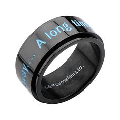 a black ring with blue lettering on the outside and inside, in an engraved design