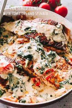 chicken with tomatoes and spinach in a skillet