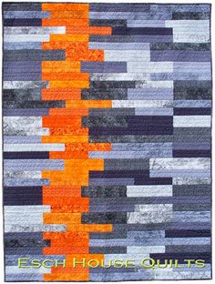 an orange and grey quilt with stripes on the front, along with text that reads easy house quilts