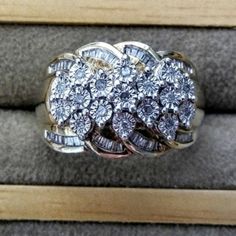 What A Statement Ring! Bling Bling! Approximately .50ctw Round & Baguette Diamonds Make Up This Ring. Set In 18k Over Sterling Silver. You Will Be Wowed At The Beauty This Has. It Is Just Amazing In Person. Absolutely No Diamonds Missing. It Is A Heavy Ring It's Very Well Made. I Am Not 100 Percent On Carat Weight That Is Approximate But It Has Lots Of Diamonds In This. No Paperwork. No Refunds. Used As Is Final Sale. Normal Wear And Scratches. Silver Cluster Diamond Ring With Baguette Diamonds, Silver Cluster Ring With Baguette Diamonds For Anniversary, Anniversary Cluster Ring With Baguette Diamonds, Baguette Diamond Cluster Ring For Anniversary, Diamond White Cluster Ring With Baguette Diamonds For Promise, Round Cluster Ring With Baguette Diamonds, Wedding Cluster Ring With Baguette Diamonds In Diamond White, Diamond White Cluster Jewelry With Baguette Diamonds, Anniversary Rings With Baguette Diamonds In Diamond White