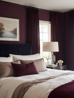 a large bed sitting in a bedroom next to a window with red drapes on it