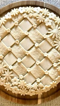 a wooden platter filled with cut out cookies