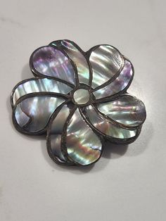 Beautiful sterling silver pin brooch with an abalone shell flower shaped design. Also has pendant loop to wear on a chain as a pendant.  G1-K Iridescent Brooch Jewelry Gift, Iridescent Brooch Jewelry For Gifts, Vintage Silver Abalone Shell Jewelry, Vintage Silver Jewelry With Abalone Shell, Abalone Shell, Shape Design, Flower Shape, Vintage Sterling Silver, Brooch Pin