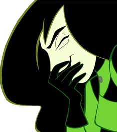 an image of a woman with her hands on her face and green coat over her shoulders