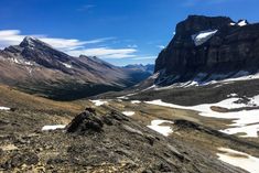 the mountains are covered in snow and rocks