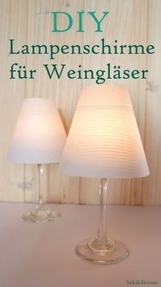 two lamps sitting on top of a table next to each other with the words diy lampenschirme fur weiniglaser