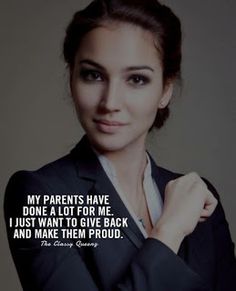 a woman wearing a suit and tie with a quote on it