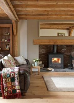 a living room filled with furniture and a fire place