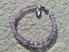 "This stacking bracelet features high quality pink amethyst in a 6mm disc shape. The gemstones are transparent, sparkling, watery and a beautiful pale violet. Finished with sterling findings and a pink amethyst wire wrapped briolette. Standard size is 7.5\" total length. If you desire a different length, please state TOTAL length you want in \"Notes to Seller\", at checkout. Ships via USPS First Class Mail. Thank you for shopping Teece Torre Jewelry." Faceted Amethyst Beads Bracelets, Amethyst Bracelets With Faceted Beads, Rondelle Amethyst Bracelet With Natural Stones, Faceted Amethyst Round Bracelets, Faceted Amethyst Bracelets, Black Spinel Bracelet, Peridot Jewelry, Padparadscha Sapphire, Ruby Beads