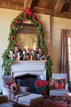 a living room filled with furniture and a fire place covered in christmas decorations on top of a mantle