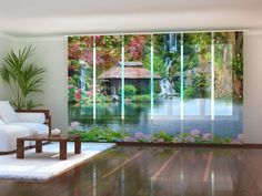 a living room filled with furniture next to a window covered in flowers and greenery