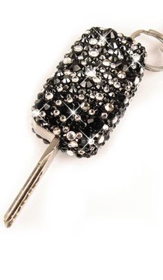 a black and white keychain with lots of beads on it