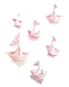 several pink paper boats floating on top of each other