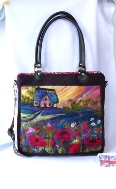 a handbag with an image of a house on the front and flowers in the back