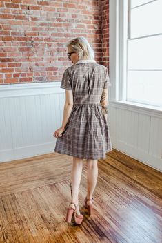 Pockets, collars and plaid...This is what we like to refer to the trifecta of all things we love! The ACADEMY dress is a classic little shirtdress with short sleeves featuring a functioning button down front bodice with a very full pleated skirt. Designed for wearing ease and comfort, the ACADEMY is patterned for a relaxed fit waistline and a back bodice pleat to allow increased mobility across the the back and shoulders. And the best part? The collar is detachable, wear this dress 2 ways! + D E