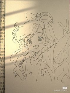 a drawing of a girl with her hand up in the air, next to an open book