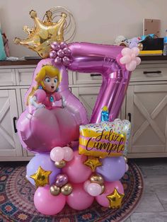 the balloon is shaped like a princess on top of balloons