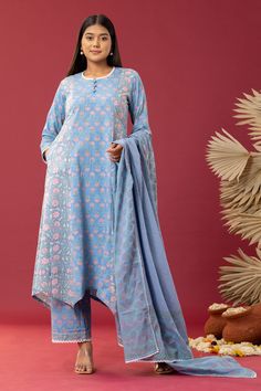 Powder blue asymmetric kurta with spring block print and scallop lace work. Paired with printed palazzo and printed, scallop hem dupatta.
Component: 3
Pattern: Printed
Type Of Work: Block Print
Neckline: Scallop
Sleeve Type: Scallop
Fabric: Kurta and Palazzo: Cotton Cambric, Dupatta: Cotton Mulmul
Color: Blue
Other Details: 
Floral print
Printed dupatta
Occasion: Puja - Aza Fashions Unstitched Blue Bohemian Sets, Blue Sets With Printed Motifs In Straight Kurta Style, Unstitched Bohemian Sets In Blue, Blue Sets With Printed Motifs In Traditional Drape, Blue Bohemian Unstitched Sets, Blue Bohemian Sets Unstitched, Blue Dupatta With Printed Motifs In Traditional Drape, Blue Block Print Palazzo Set With Long Sleeves, Blue Saree Sets With Printed Motifs