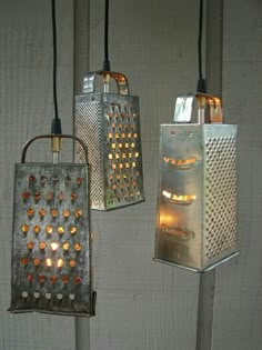 three hanging lights that are made out of tin cans and some glass beads on them