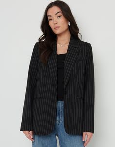 Get the tailored look this season with this timeless classic pinstripe blazer from Threadbare. Immerse yourself in the comfort of the fully lined body and sleeves. The blazer's classic design is accentuated by two front pockets and a breast pocket. Has a button to fasten closed and a button on the cuffs. Pair with jeans and a white tee for simple chic, or style over a slip dress with a heel for date night glam. Matching skirt available. Size: Model is 5′ 6″ and wears size 8 Composition: 63% Poly Black Striped Blazer Outfit, Black And White Blazer Outfit, Striped Blazer Outfit, Chic Blazer Outfit, Corporate Girly, Black Blazer Outfit