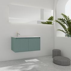 a bathroom with a sink, mirror and plant in it