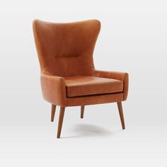 an orange leather chair with wooden legs and armrests, on a white background